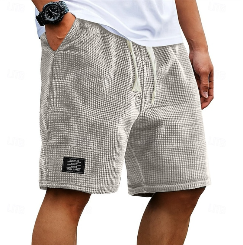 Breathable men's relaxed fit shorts, perfect for summer comfort & versatile everyday wear.