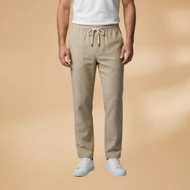 Model wearing comfortable men's relaxed fit trousers in black.