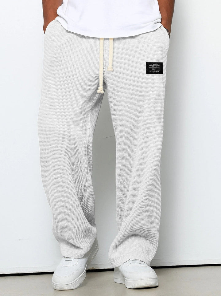 Breathable men's relaxed fit trousers, perfect for versatile everyday comfort & modern style.
