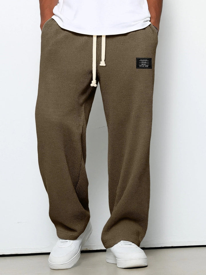 Everyday comfort men's relaxed fit trousers with a breathable, straight leg design.