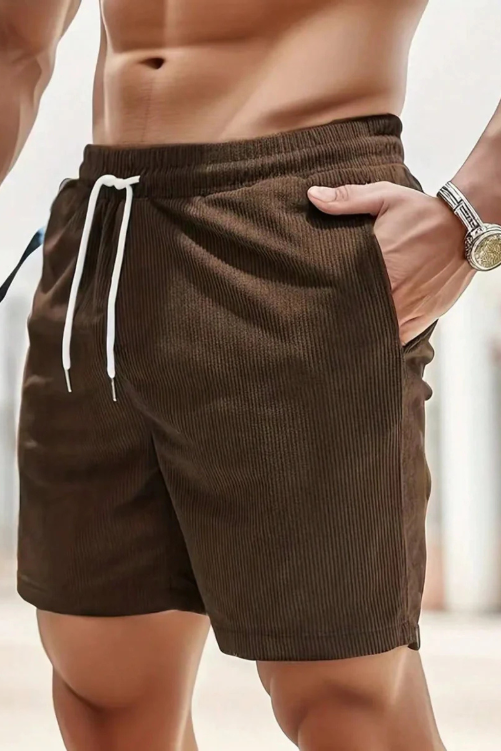 Grey men's corduroy shorts with a drawstring waist, combining style and comfort.