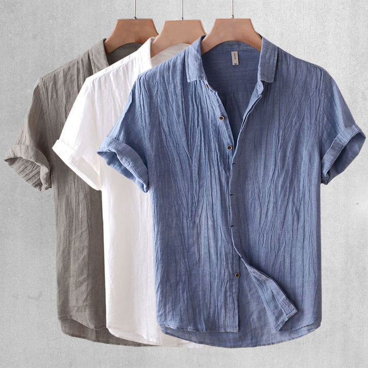Textured crinkle fabric men's short sleeve top, relaxed fit, lightweight & breathable summer shirt.