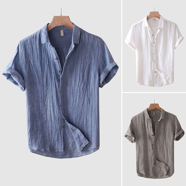Men's summer relaxed fit crinkle short sleeve shirt, casual button-up style for warm weather outings.