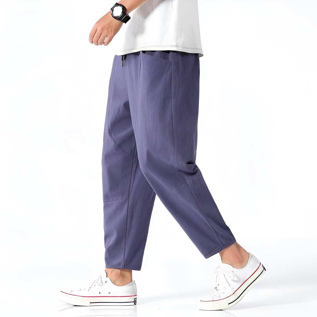 Back view of men's stylish relaxed fit cropped chinos, perfect for effortless casual summer comfort.