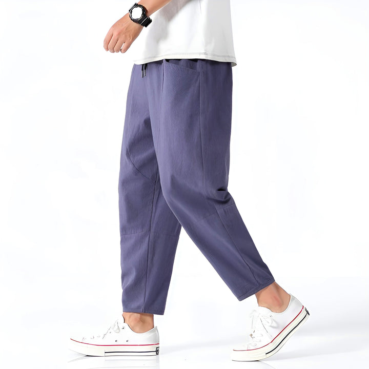 Back view of men's stylish relaxed fit cropped chinos, perfect for effortless casual summer comfort.