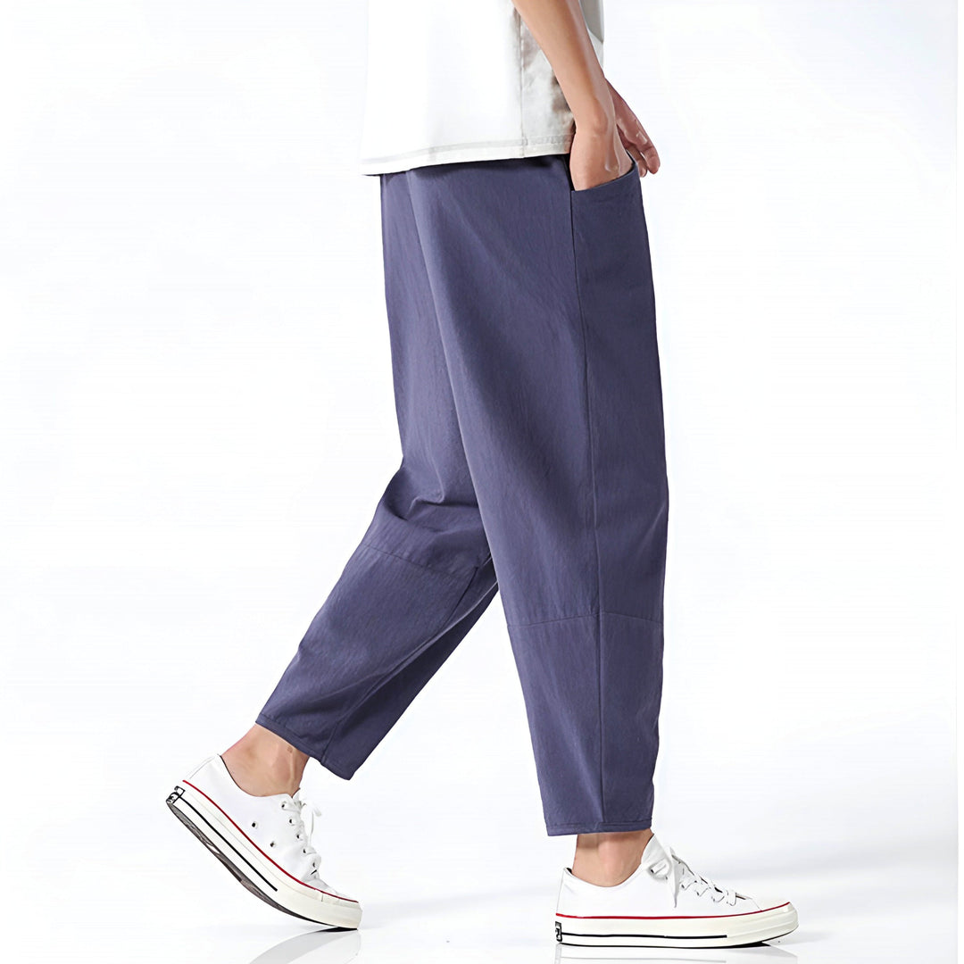 Close-up of premium fabric on men's relaxed fit cropped chinos, ensuring comfort & quality for summer style.