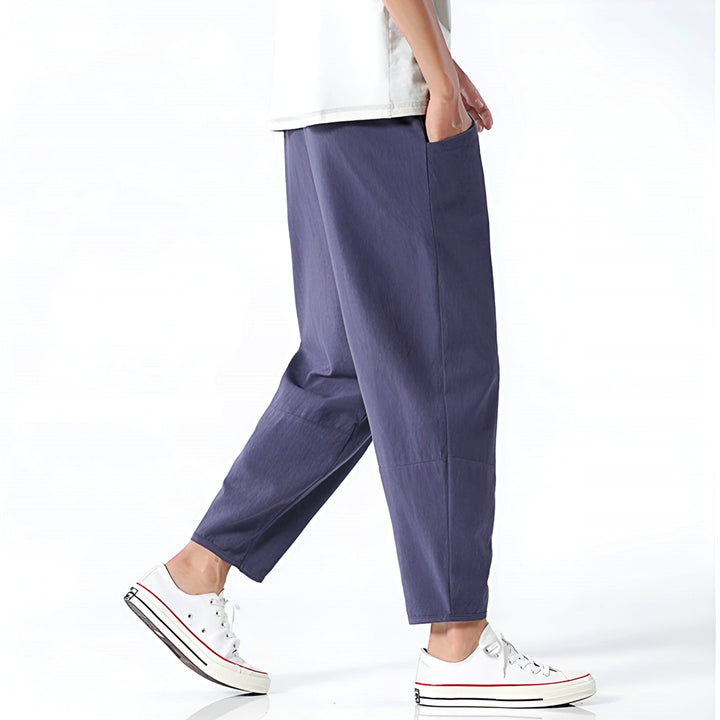 Close-up of premium fabric on men's relaxed fit cropped chinos, ensuring comfort & quality for summer style.