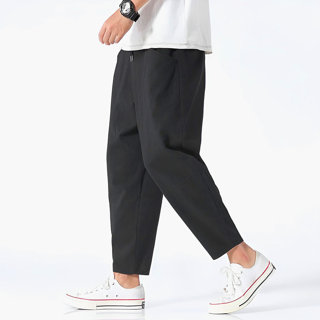 Navy men's stylish relaxed fit cropped chinos, perfect for a modern casual summer outfit.