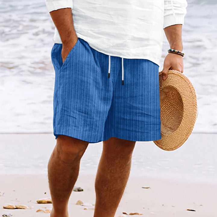 Men's relaxed fit drawstring shorts with pockets, combining casual style and practical comfort for summer.