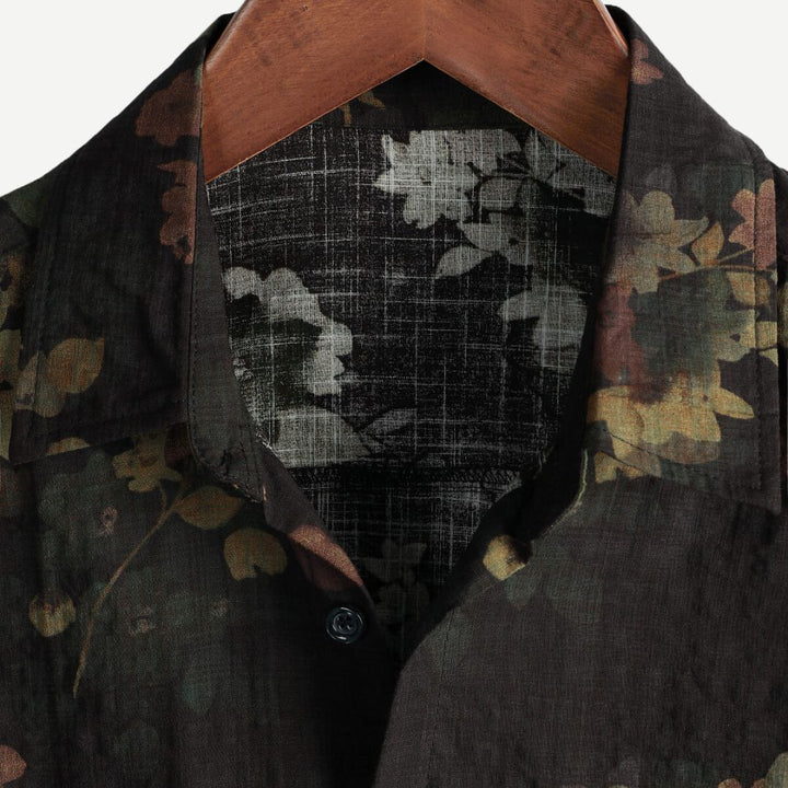 Stylish men's green floral short-sleeve shirt. Relaxed fit, vibrant print, great for casual summer fashion.