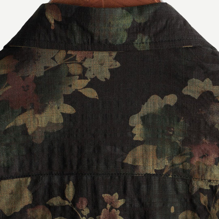 Vacation-ready men's relaxed fit short-sleeve floral shirt. Green, vibrant print, perfect for summer style.