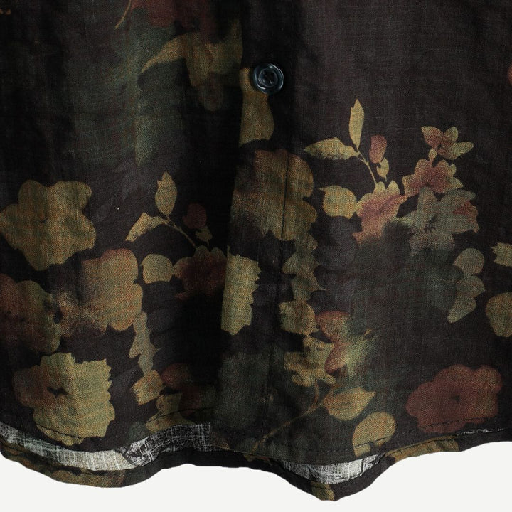 Green floral short-sleeve button-down shirt for men. Relaxed fit, comfortable, vibrant print, casual summer fashion.