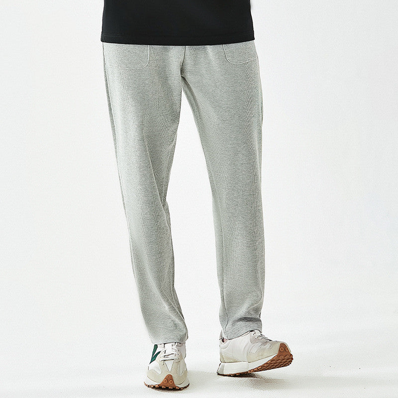 Men's relaxed fit joggers with a drawstring waist, perfect for athletic activities, casual wear, or comfortable loungewear.
