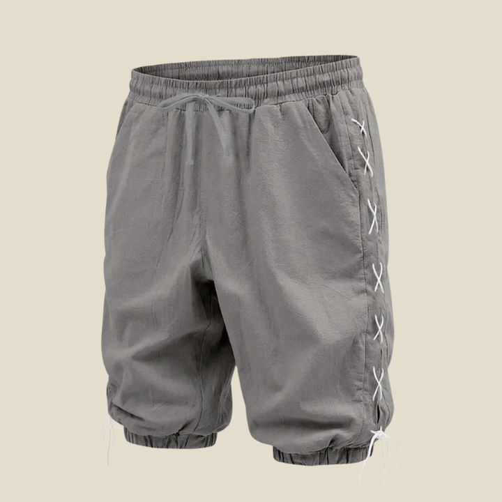 Men's streetwear shorts: relaxed fit, knee-length, with adjustable drawstring and stylish lace-up side detailing.