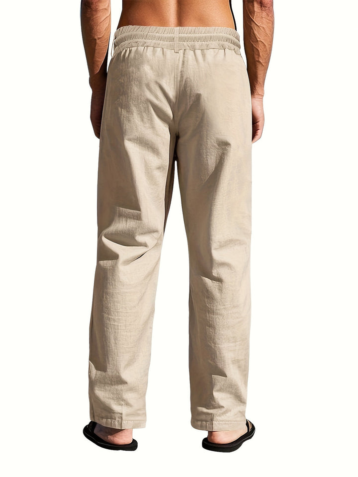 Experience summer comfort with these men's relaxed linen trousers, featuring a practical drawstring.