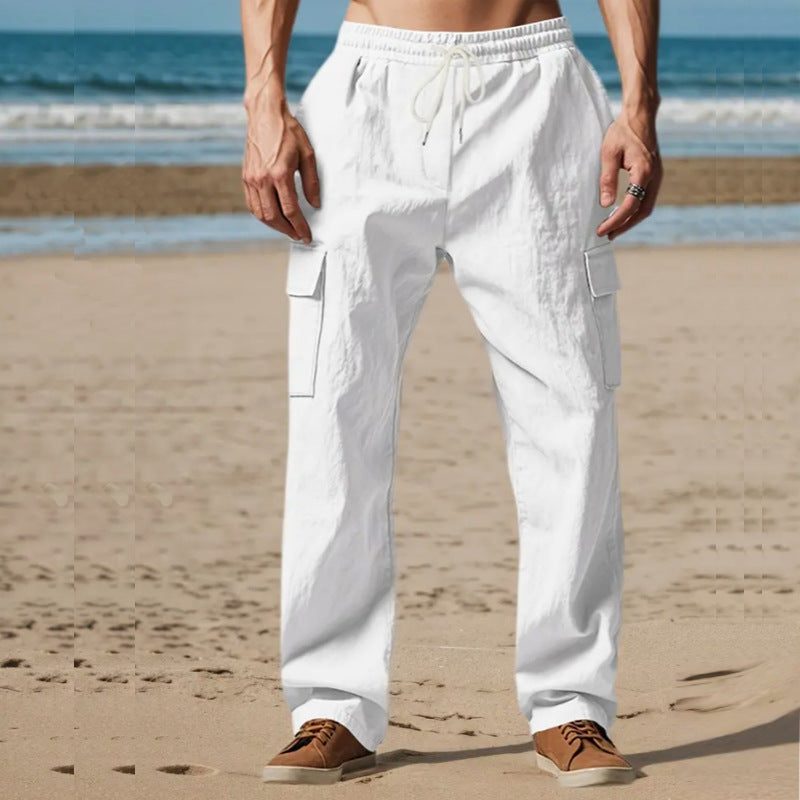 Comfortable men's linen cargo pants, relaxed fit for summer wear. Breathable & stylish holiday attire.