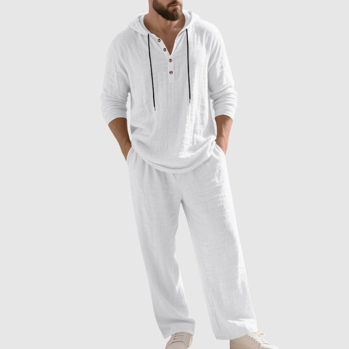 Man wearing a stylish men's linen relaxed-fit hooded set, ideal for comfortable casual wear and summer outings.