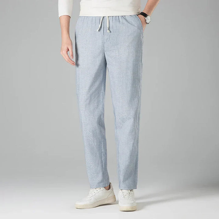Men's relaxed fit linen trousers with drawstring waist, ideal for summer comfort & casual wear.