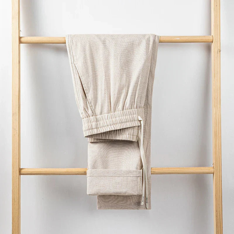 Comfortable men's relaxed fit linen trousers with drawstring waist, perfect casual pants for summer.