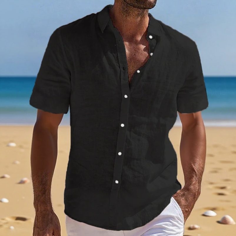 Stylish men's short sleeve button-up shirt, ideal for beachwear or a relaxed holiday look.