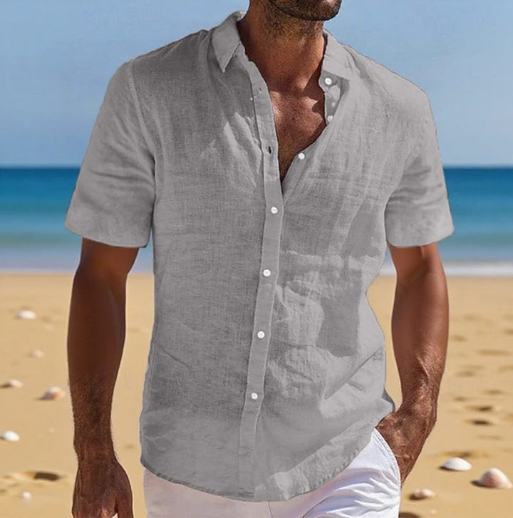 Classic men's casual short sleeve button-up shirt, offering a relaxed fit for modern beach fashion.