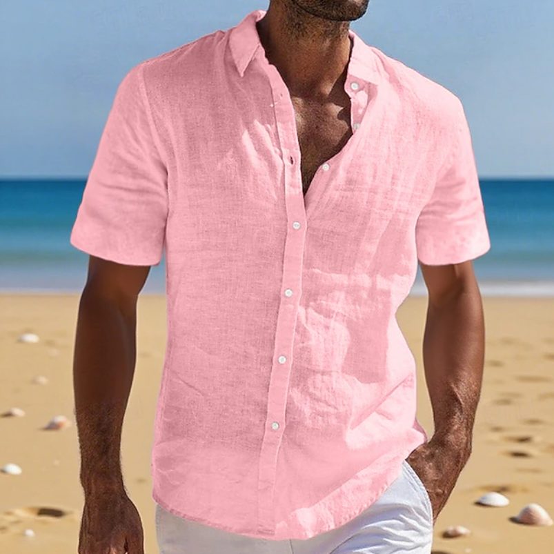 Men's button-up shirt with short sleeves, featuring a relaxed fit for stylish summer and holiday outfits.