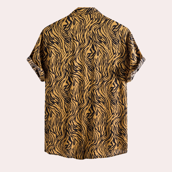 Stylish men's animal print button-front shirt with a relaxed fit, ideal for casual summer outfits.