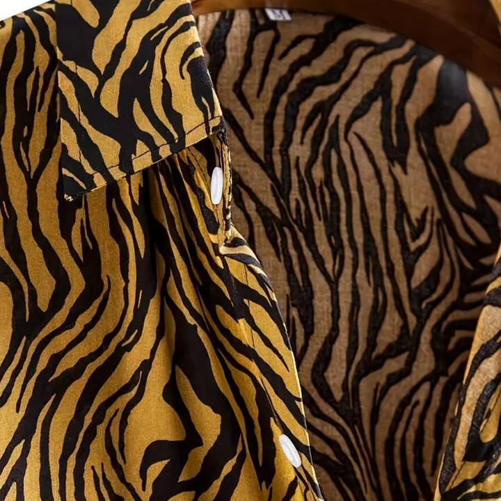 Men's short-sleeve tiger print shirt featuring a comfortable relaxed fit, great for stylish casual looks.