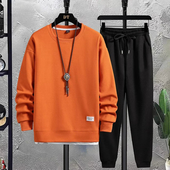 Sporty men's two-piece tracksuit set, a relaxed fit casual outfit. Great for everyday style & comfort.