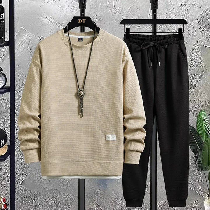 Relaxed fit men's tracksuit set featuring a comfortable loungewear design. Perfect for men's fashion.