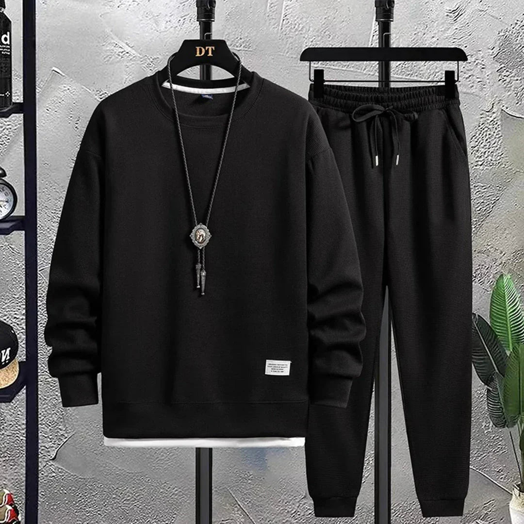 Trendy men's fashion tracksuit, a relaxed fit two-piece set for sporty style and casual comfort.