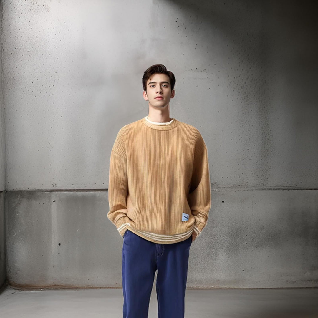 Close-up of a men's striped relaxed fit sweater, highlighting the cozy fabric & stylish pattern.