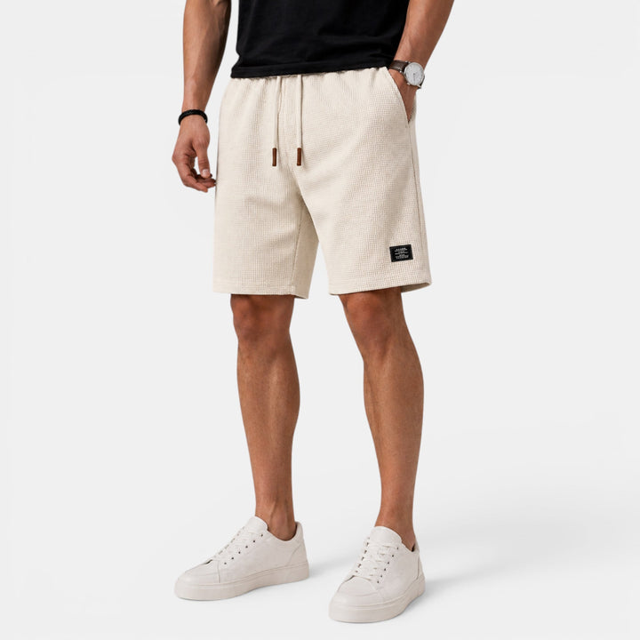Men's relaxed fit summer shorts with elastic waist, ideal for casual warm weather fashion.