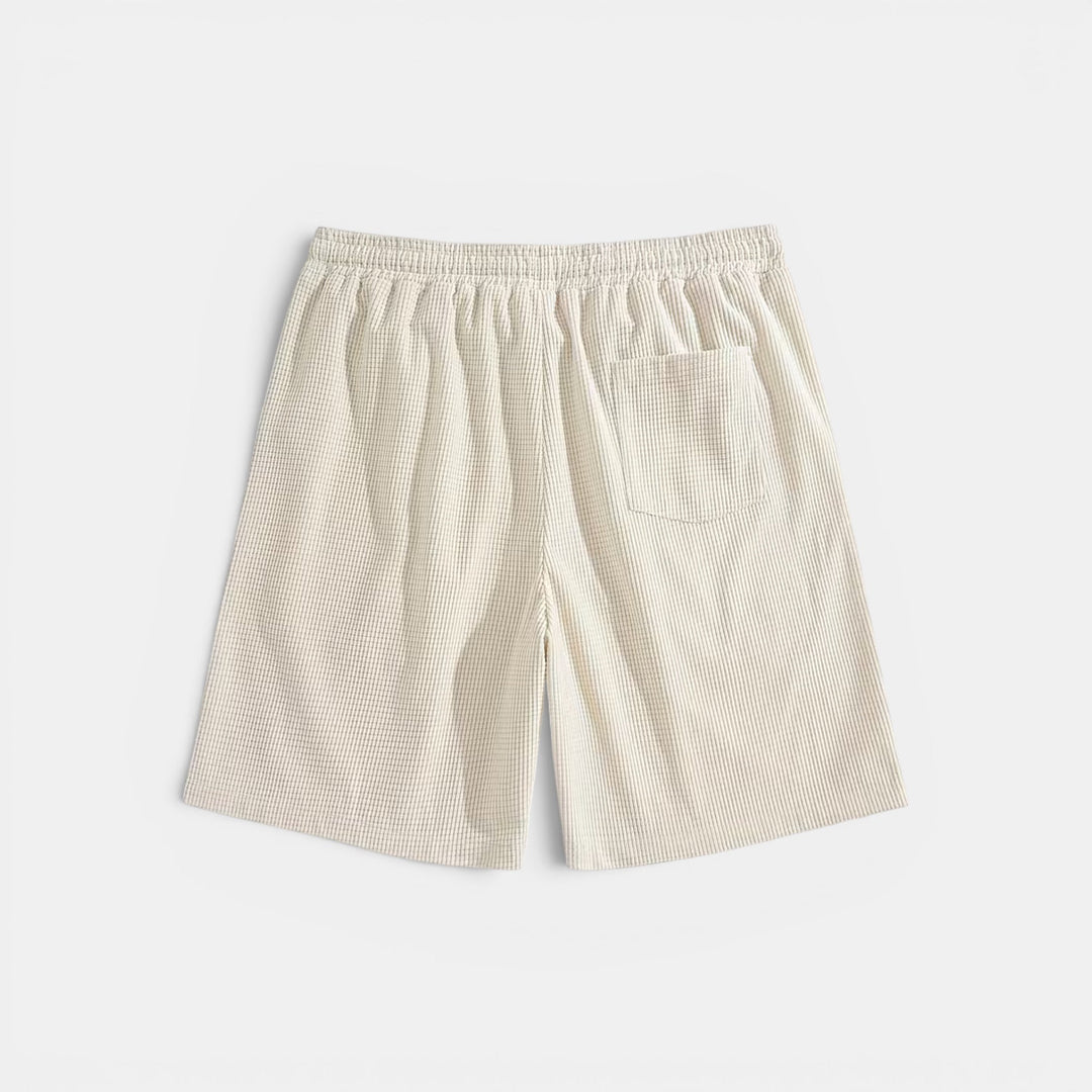 Elastic waist men's shorts in a relaxed fit, designed for comfortable summer wear and casual style.