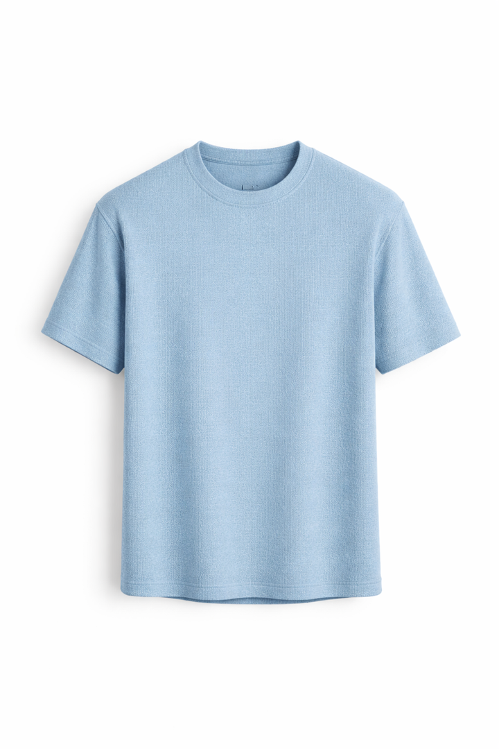 Close-up of a men's textured short sleeve t-shirt, showcasing the fabric and relaxed fit ideal for summer fashion.