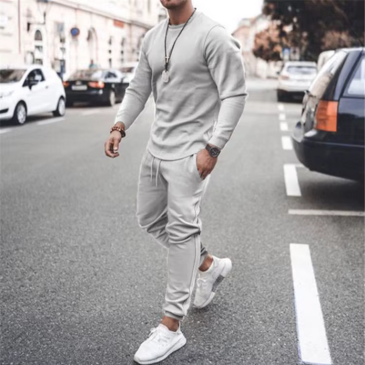 Men's relaxed fit two-piece casual set in a versatile neutral tone. Cotton blend loungewear for comfort.