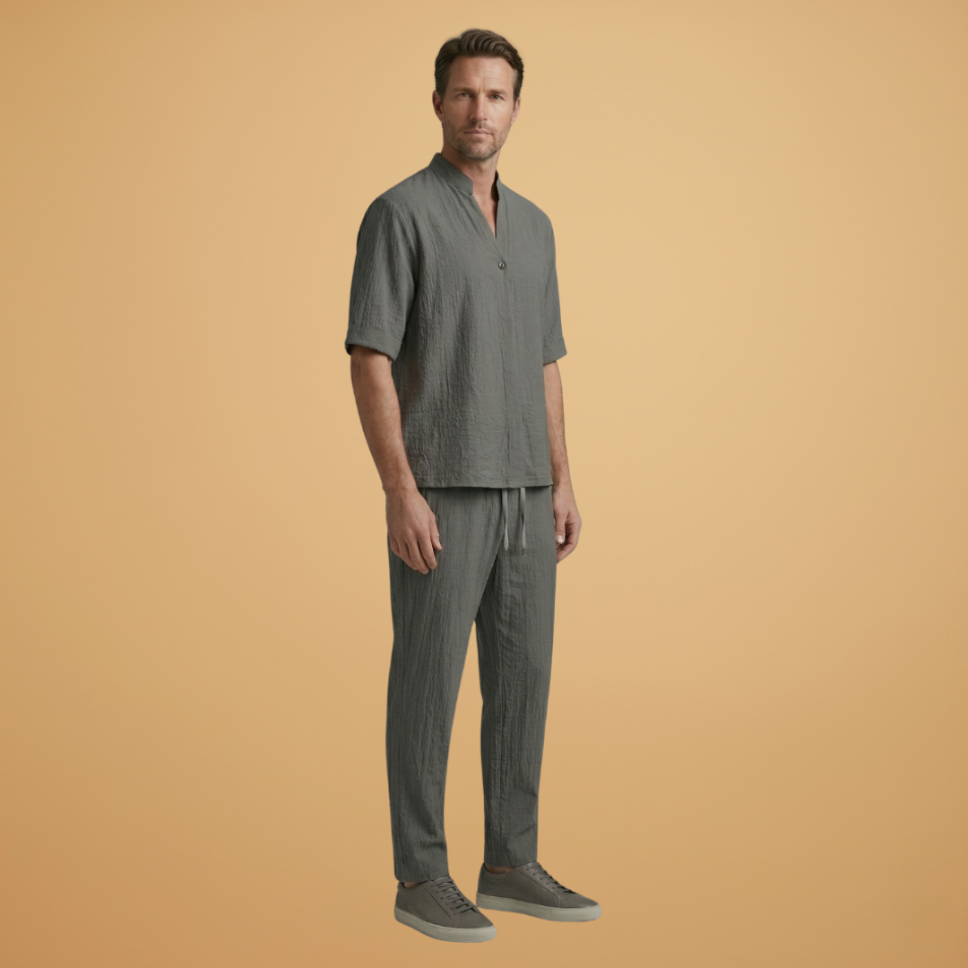 Men's summer casual outfit with a relaxed long sleeve top and comfortable drawstring pants. Coordinated look.