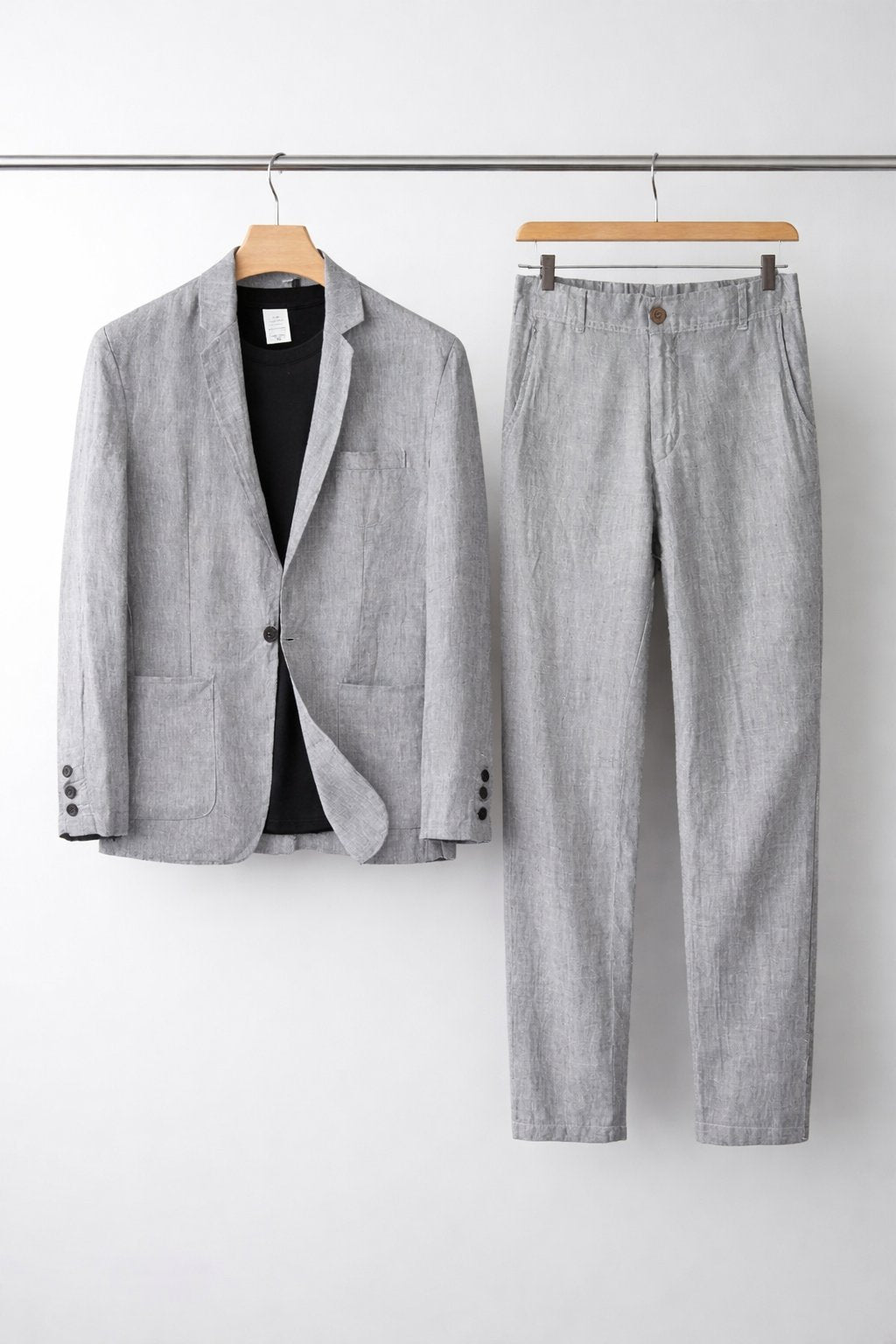 Spring/Summer men's two-piece suit, relaxed fit blazer and dress pants for comfortable, stylish work attire.