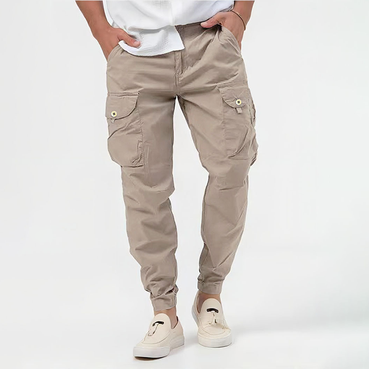 Stylish men's multi-pocket utility cargo pants with adjustable drawstring waist, ideal for workwear and men's fashion.