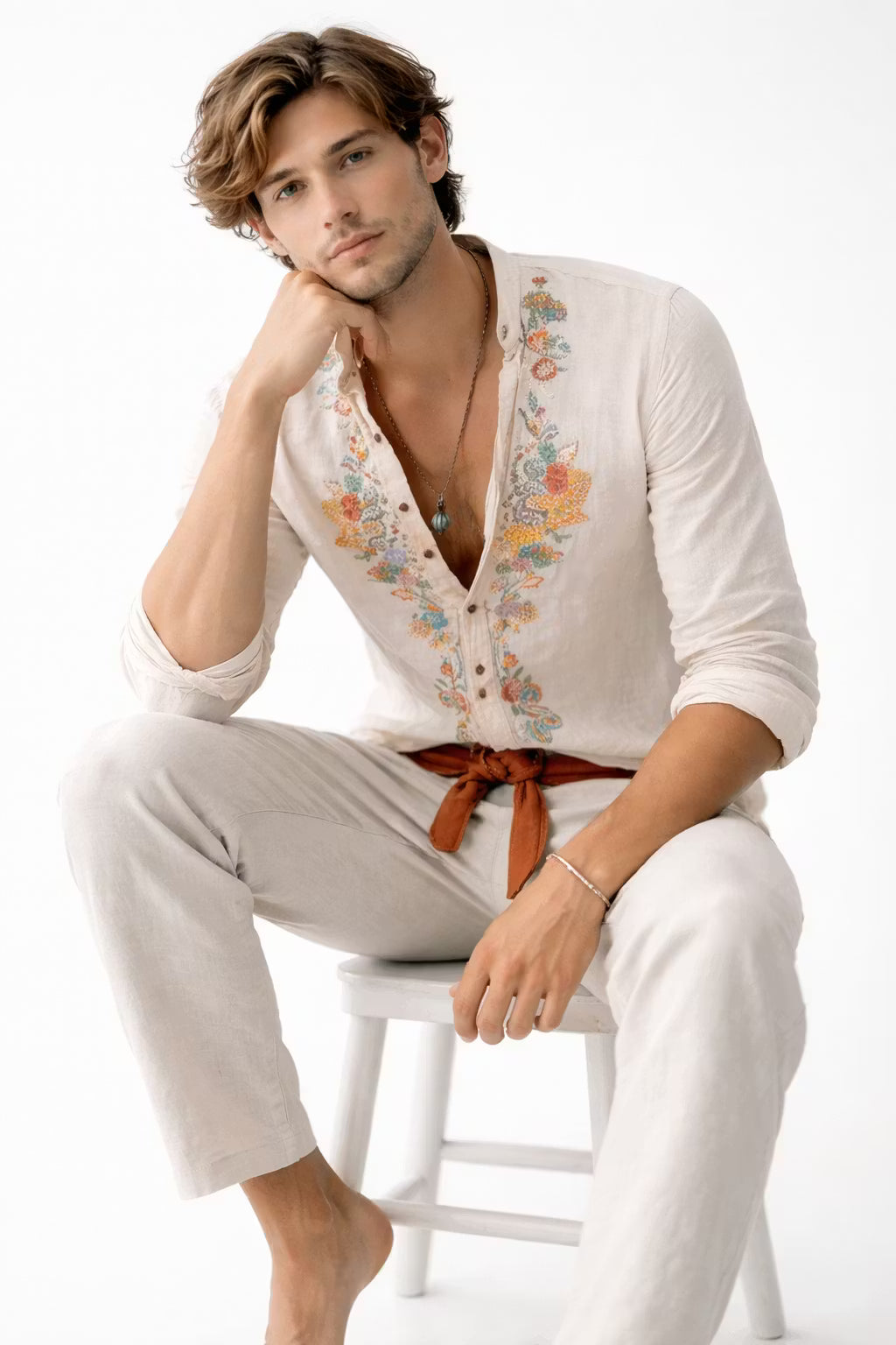 Fashionable men's floral embroidered V-neck shirt, designed with a relaxed fit for comfortable summer style.