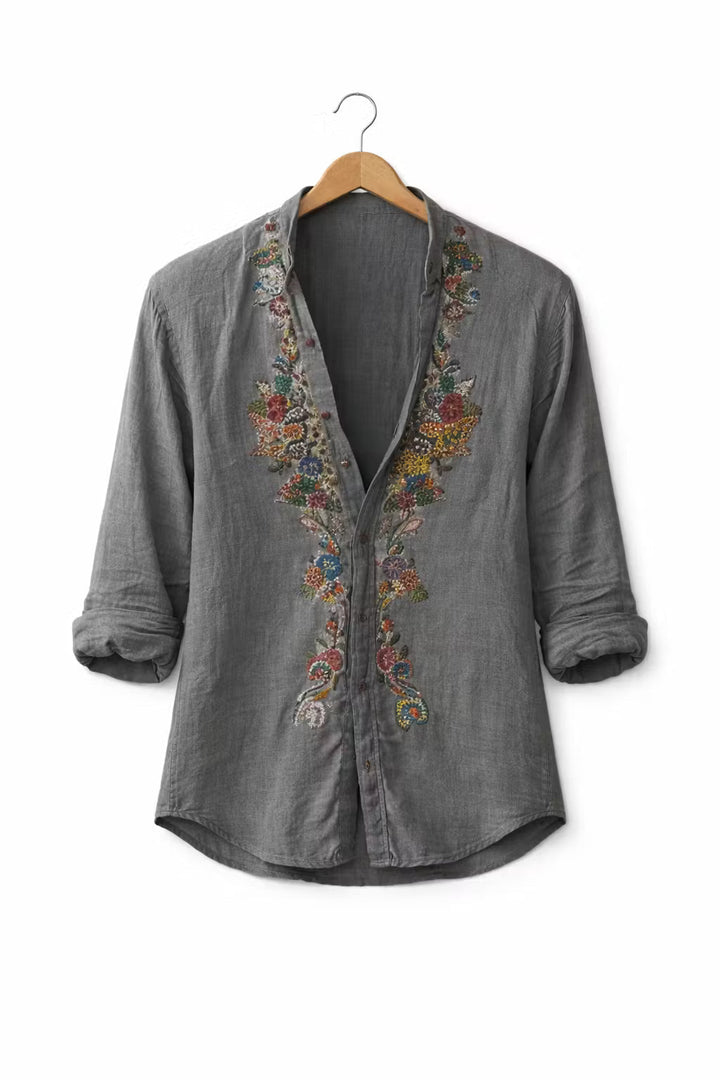 Stylish men's relaxed fit V-neck shirt, detailed with eye-catching floral embroidery, a must-have for summer fashion.