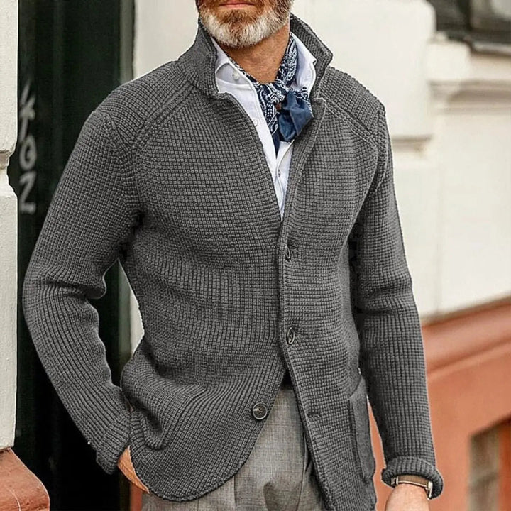 Relaxed fit men's waffle knit cardigan. A comfortable button-up jumper, ideal layering piece for smart casual outfits.