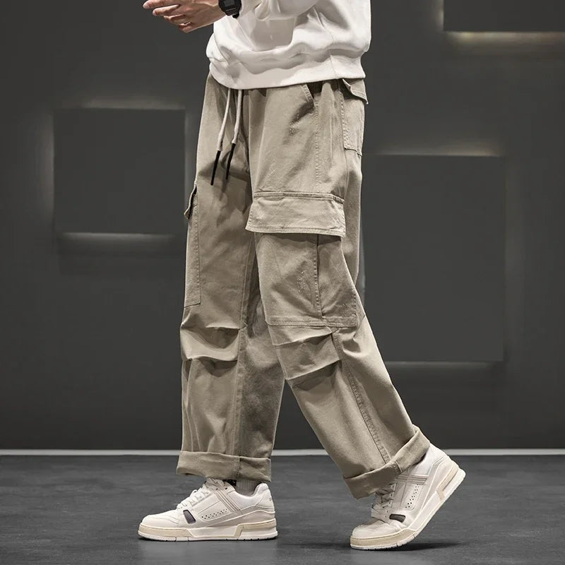 Stylish men's wide leg cargo trousers, relaxed fit with drawstring, offering versatile casual comfort.