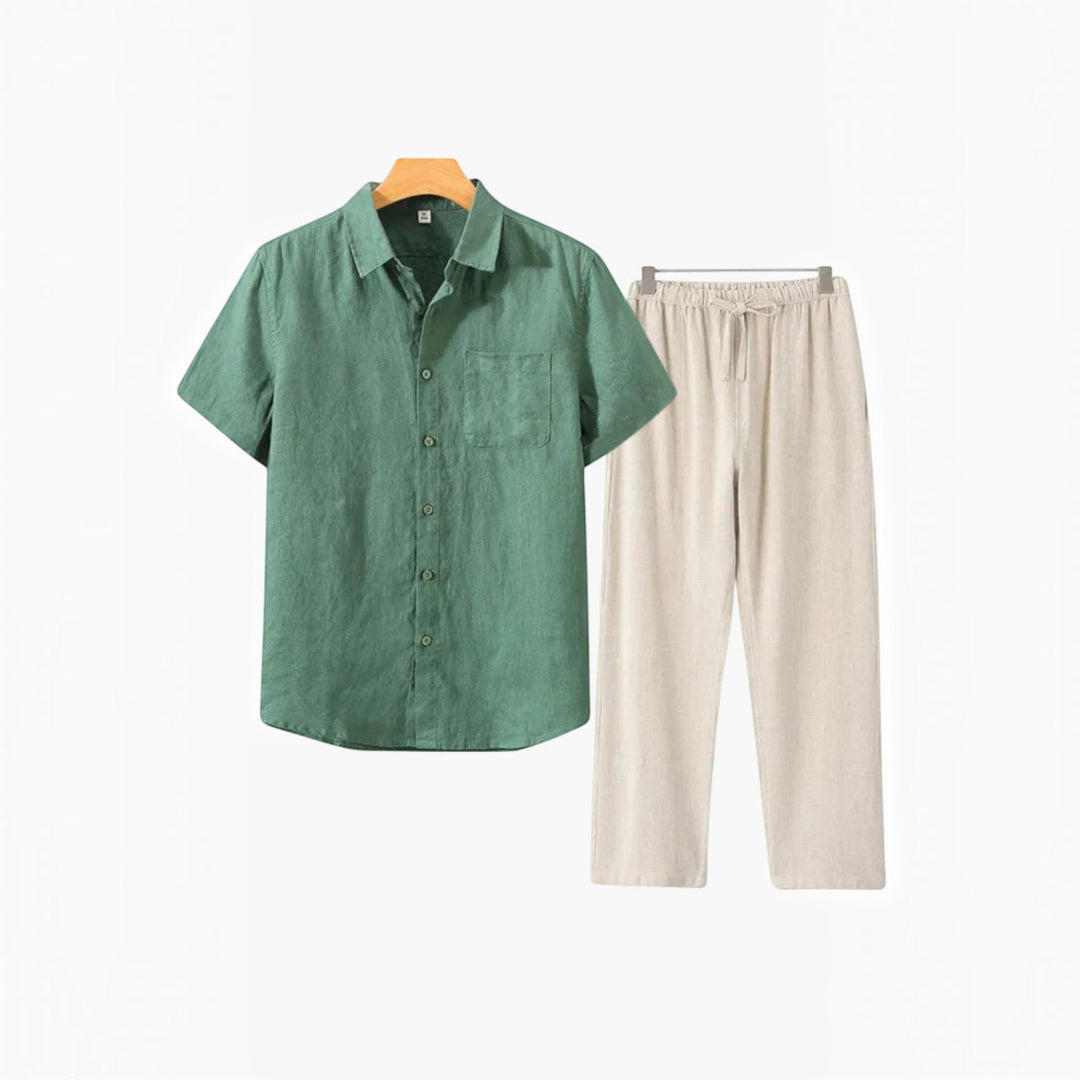 Man in a men's relaxed shirt and shorts set, enjoying a beach vacation. Perfect resort wear.