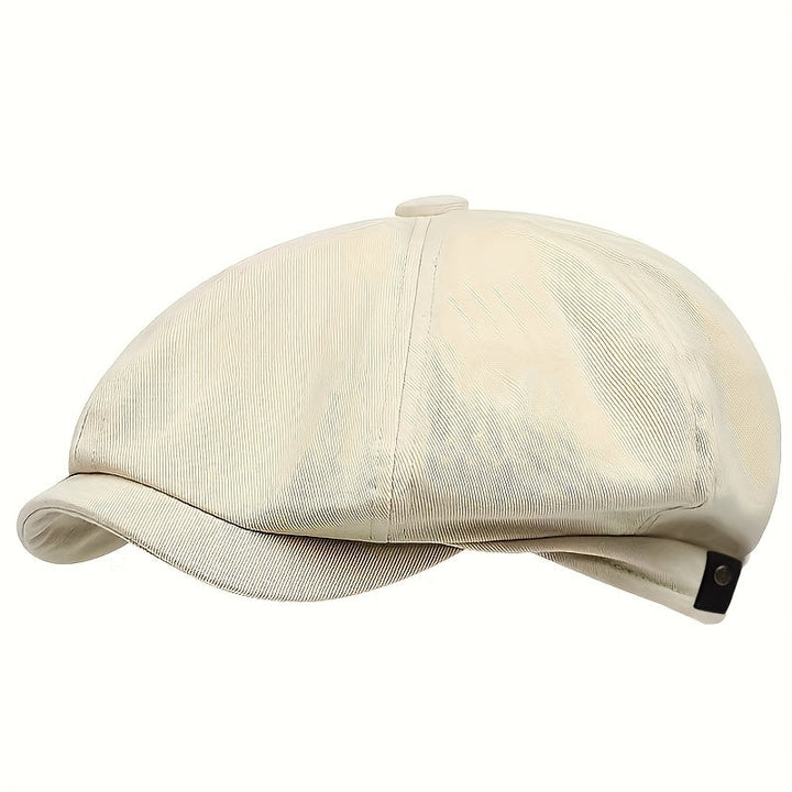 Men's retro herringbone flat cap on a display stand, showcasing its appealing vintage style and form.