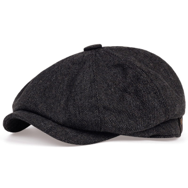 Stylish man wearing a retro herringbone flat cap, a classic vintage accessory for casual men's fashion.