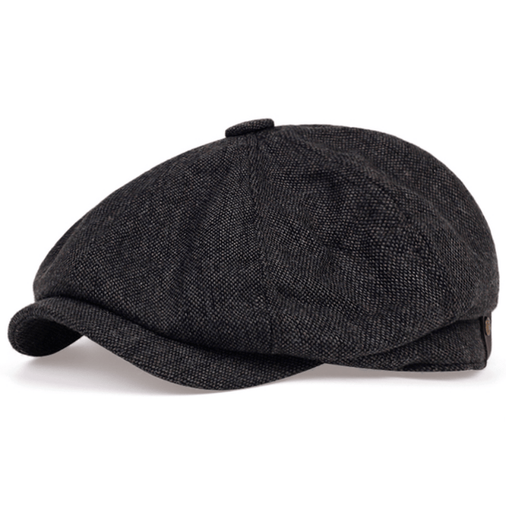 Stylish man wearing a retro herringbone flat cap, a classic vintage accessory for casual men's fashion.