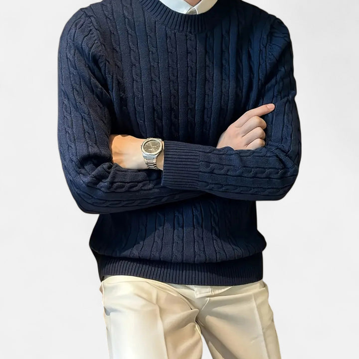 Elegant man in a smart casual ribbed crew sweater, a warm top for versatile men's fashion.