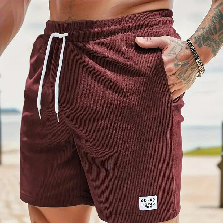Relaxed fit men's casual shorts, ribbed design, practical drawstring for laid-back style.