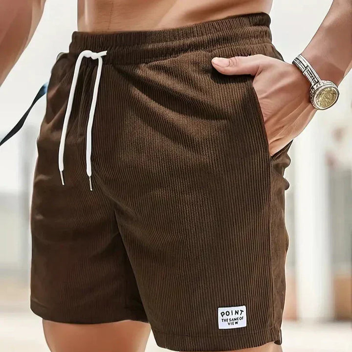 Trendy men's loungewear shorts, ribbed texture, adjustable drawstring for home or casual outings.
